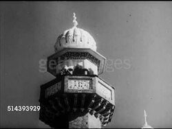 1953: LAHORE, PAKISTAN: HA Masjid (Mosque) minerat w/ muezzin (crier) performing adhan (the call to worship), VS Muslim men praying, holding hands off side of face, on knees in prayer, bowing, VS Many people praying in Badshahi Masjid courtyard, Instructional Video