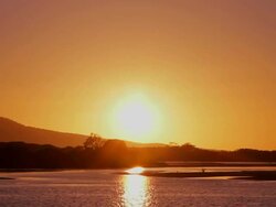 WS Sun rising over Mallacoota Estuary / Mallacoota, Victoria, Australia Stock Footage