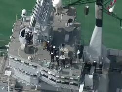 Crew standing on deck of HMS Illustrious News Clip