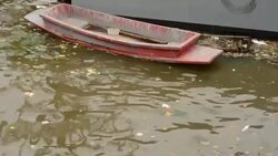 Water pollution in river with boat Stock Footage
