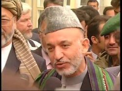 Voting begins; Karzai voting News Clip
