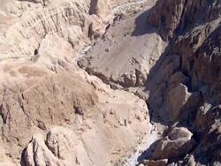 Aerial steep sided canyon in the Judea Desert, Israel Stock Footage