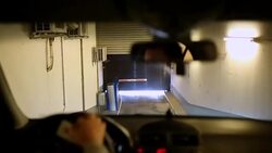 Car out of the underground garage Stock Footage