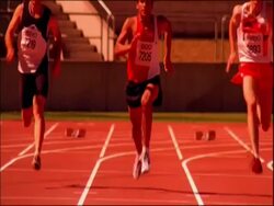 MS tilt up to athletes running to camera on track, Australia Stock Footage