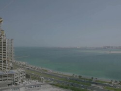 WS View of building under construction and beach / Doha, Qatar  Stock Footage