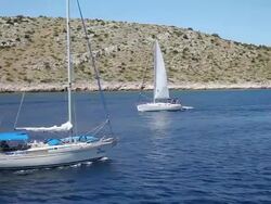 A sailnig boats near the Zut island, Kornati National Park Stock Footage