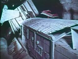 Crushed rock dumping from mine rail car Stock Footage