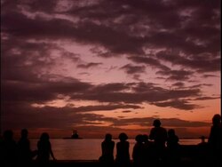 WA silhouetted group of people watching the sunset, Manila Bay, Philippines Stock Footage