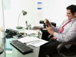 Businessman watching a calendar in an office  Stock Footage