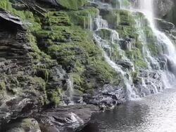 MS CU View of  'Canaima Lake' and its waterfalls and regional canoe / Canaima / Los roques,Bolivar State, Venezuela  Stock Footage