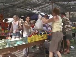 MS View of Outdoor market and two people purchasing fruits / Palma de Majorque, Majorque, Spain Stock Footage