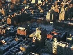 Aerial flying over downtown Manhattan and Washington Square Park New York, NY covered in snow Stock Footage