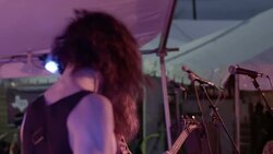Heavy metal band rock out on music festival stage in slow motion Stock Footage