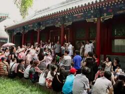 MS Shot of tour guide with tourists at Prince Gongs Mansion / Beijing, China Stock Footage