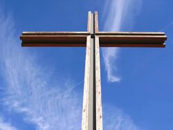 HD Christ Cross against sky tilt up & time lapse Stock Footage