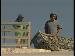 Situation tense as scuffles continue outside disputed house News Clip