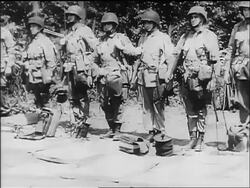 B/W June 5 1944 PAN line of Pathfinder soldiers standing at attention on eve of D-Day / Europe Stock Footage
