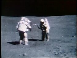 1972 two astronauts taking soil sample on Moon / Apollo 16 Stock Footage