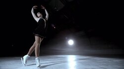 SLO MO DS Female figure skater holding an elegant pose Stock Footage
