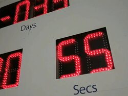 Speeded up digital countdown on big board: relativity of time Stock Footage