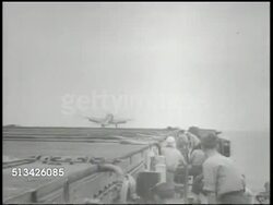 1940s: UNITED STATES NAVY: VS U.S. Navy Corsair fighter planes taking off from aircraft carrier deck, runway, crew preparing plane for launching, locking in place aircraft catapult on deck. WWII, World War II, Pacific Front Instructional Video