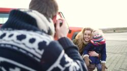 MS Father taking family picture with digital camera Stock Footage