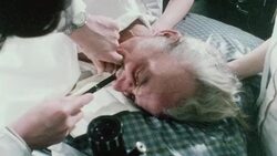 1970 SHAKY Clinic technicians performing a gastroscopy on an elderly male patient / London, England Stock Footage