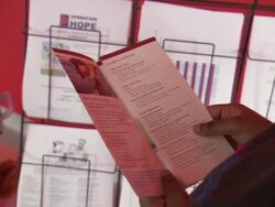 MS Health insurance pamphlet being reviewed AUDIO  / New York City, New York, United States Stock Footage