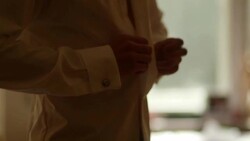 Man buttoning shirt - stock footage Stock Footage