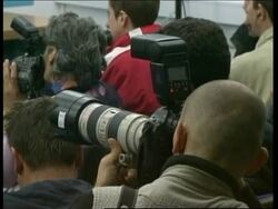 Injured police transported by convoy, UN/US comment, scene News Clip