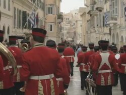 MS Red band playing in street at easter parade AUDIO / Kerkyra, Corfu, Greece Stock Footage