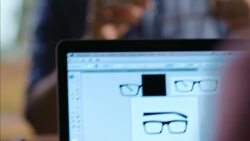 Wood shop owner teaches workers how to assemble glasses Stock Footage