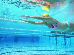 HD Super Slow-Mo: Young Woman Swimming Breaststroke Stock Footage