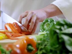 MS PAN Slicing of orange pepper / Seattle, Washington, United States  Stock Footage