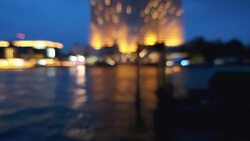 Bokeh of cityscape along river Stock Footage