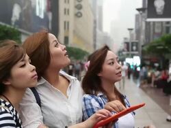 Young women sharing music in the room Stock Footage