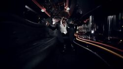 Hip-hop star dances and sings in limousine while paparazzi crowd windows outside at awards show Stock Footage