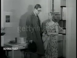 1948: NEW YORK NEWLYWEDS: DRAMATIZATION: Young woman entering kitchen, putting on apron, husband home from work, SOT about boss coming to dinner, not yet started, wife explaining at Mabel's, wouldn't want her to give up girlfriends for his boss. Instructional Video