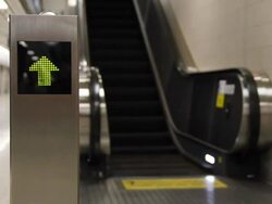 Arrow sign to upstairs with escalator. Stock Footage