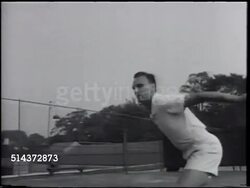 1966: VICTOR SEIXAS: LA (BEHIND tennis net) WS Vic walking up court, VS Serving, hitting, playing practice tennis w/ unidentified male.   [VO Vic on tennis, didn't want to make living on it, play for fun, competition, thrill of making good shot. ] Instructional Video