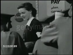 1942: 'POST EXCHANGE' RESTAURANT: CU Sign. INT VS Cadets at bar, drinks, waitress, Coca-Cola logo BG. REPRISAL: VS Men flirting w/ waitress '...you're getting better looking every day,' asking for date, waitress declining (SOT). Fort Slocum, New York Instructional Video