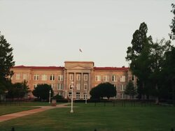 Drive by, stately collegiate campus building with columns, Hill Hall Stock Footage