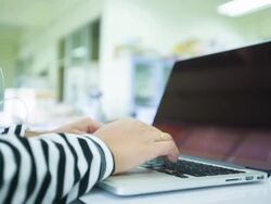 Woman using laptop computer Stock Footage