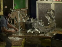 An artist carves a dragon-horse ice sculpture. Stock Footage