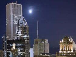 MS T/L Full moon rising over town / Chicago, IL, United States Stock Footage