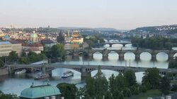 Ferryboats navigate under bridges that span the River Vltava in Prague. Stock Footage