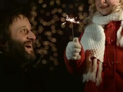 Father Lighting Sparkler To His Daughter Stock Footage