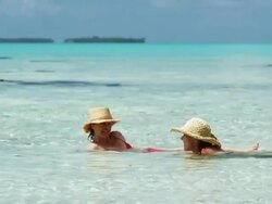 two women swimming in the ocean Stock Footage