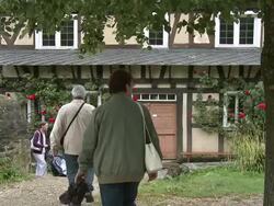 WS PAN People walking in museum Roscheider Hof / Konz, Rhineland-Palatinate, Germany Stock Footage