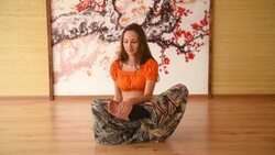 One girl in yoga class meditating in lotus position Stock Footage